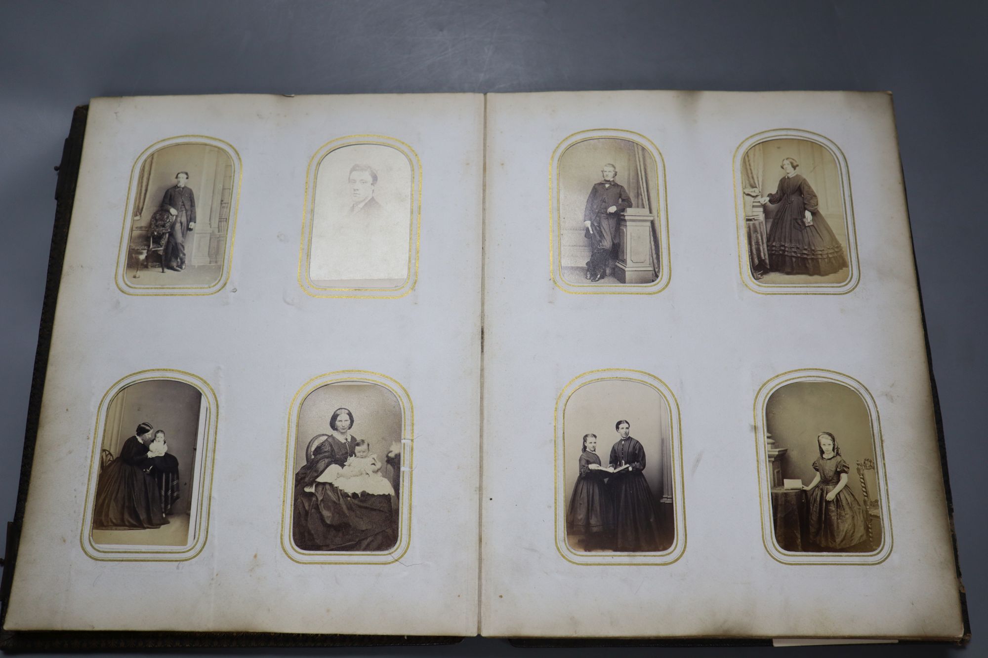 A Victorian album of cabinet portraits and one other sparsely mounted album (2)